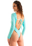 Womens rash guard one piece suit with long sleeves and high leg cut, thong back, sexy womens rash guard for surfing and fishing, turquoise, aqua, Woman wearing a blue and green patterned swimsuit on a white