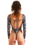 Womens rash guard one piece suit with long sleeves and high leg cut, thong back, sexy womens rash guard for surfing and fishing, congo jungle print Woman wearing a blue and green patterned swimsuit on a white