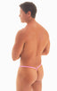 mens micro g string sexy swimsuit bikini in best seller skinz swimwear in Light pink, candy pink,; Stuffit Pouch G String Swimsuit in Pink 2; Stuffit Pouch G S, Man wearing a pink thong against a white background