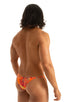 mens extreme micro string bikini tiny swimsuit by skinz swimwear in Tan Through Orange Jungle; Stuffit Pouch Half Back Swimsuit in Tan Through Orange Jungle 2;