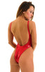 One Piece Keyhole Rio Bikini in Holographic Lipstick Red, Front View; One Piece Keyhole Rio Bikini in Red Shattered Glass, Rear View; One Piece Keyhole Rio Biki