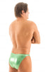 Fitted Bikini Bathing Suit in Ice Karma Emerald Green, Front View; Fitted Bikini Bathing Suit, Back View; Fitted Bikini Bathing Suit A man wearing a metallic green Brazilian-style bikini posing for the camera.