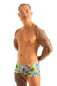 mens swimwear extreme low square cut swimsuit boxer trunks by skinz swimwear in Tan Through Lilly Lagoon fabric; Extreme Low Square Cut Swim Trunks in Tan Through Fabric