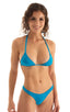 Brazilian Triangle Swim Top  in Turquoise tricot in nylon/lycra 1; Brazilian Triangle Swim Top  in Black. This image features a striking blue Brazilian triangle bikini top, designed with a low Brazilian cut. The bikini top is depicted in a solid turquoise color with adjustable cups to accommodate various sizes and preferences.